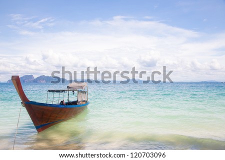 Long Tail Boat at tropical White Sand Beach Trang near Phuket Thailand