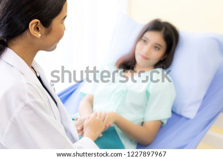 medical doctor holding patient\'s hands to cheer up patient