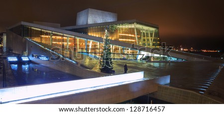 OSLO, NORWAY - DECEMBER 31: National Oslo Opera House shines at night on December 31, 2012. Oslo Opera House was opened on April 12, 2008 in Oslo, Norway