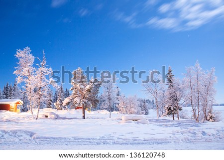Garden and playground landscape in Winter at night in Kiruna Sweden at Night with star trail
