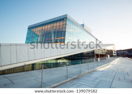 OSLO, NORWAY - JANUARY 1: National Oslo Opera House shines at sunrise on January 1, 2013. Oslo Opera House was opened on April 12, 2008 in Oslo, Norway