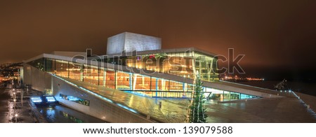 OSLO, NORWAY - DECEMBER 31: National Oslo Opera House at night on December 31, 2012. Oslo Opera House was opened on April 12, 2008 in Oslo, Norway