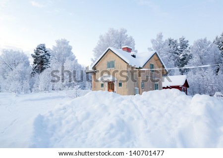 Winter landscape with house at Kiruna Sweden