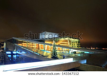 OSLO, NORWAY - DECEMBER 31: National Oslo Opera House shines at night on December 31, 2012. Oslo Opera House was opened on April 12, 2008 in Oslo, Norway