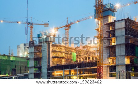 Big Construction Site Cranes at dusk