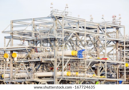 Assembling of liquefied natural gas Refinery Factory with LNG storage tank using for Oil and gas industry background