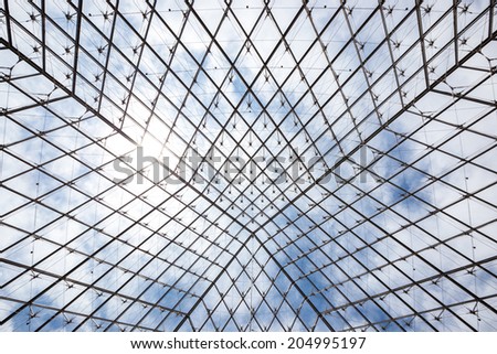 Paris - June 23: Louvre museum roof on June 23, 2014 in Paris. This is one of the most popular tourist destinations in France displayed over 60,000 square meters of exhibition space..