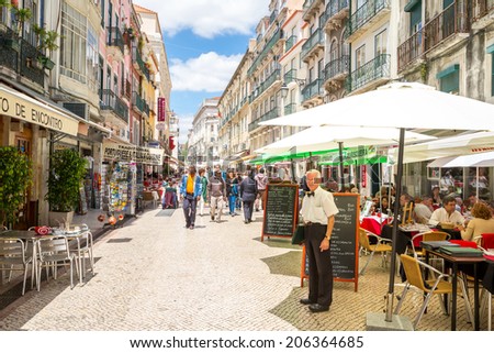 Lisbon, Portugal - MAY 26: Unidentified tourists are walking at Santo Antao street  on May 26, 2014 at Lisbon ,Portugal. Santo Antao is a lively pedestrian street known for its seafood restaurants.