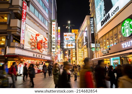 OSAKA, JAPAN - DEC 2: Unidentified tourists are shopping at Dotonbori on Dec 2, 2013 in Osaka, Japan. With a history reaching back to 1612, the districtis now one of Osaka's  tourist destinations.