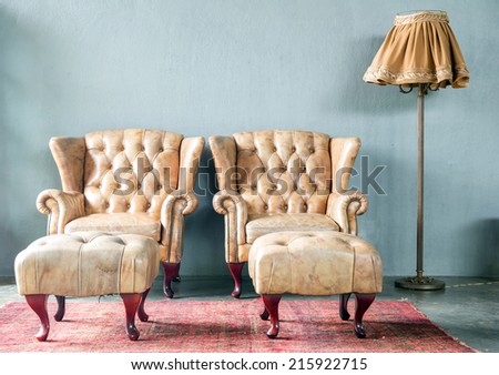 genuine leather classical style sofa in vintage room with desk lamp
