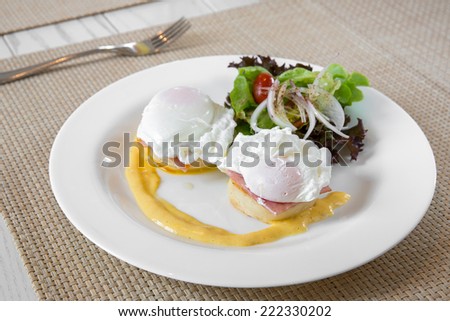 Eggs Benedict- toasted English muffins, ham, poached eggs, and delicious buttery hollandaise sauce for breakfast