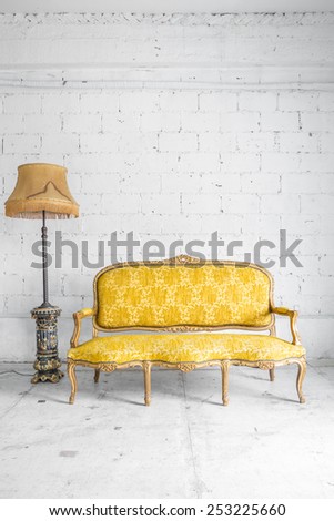 Yellow Classical style Armchair sofa couch in vintage room with desk lamp