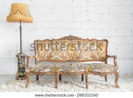 Classical style Armchair sofa couch in vintage room with desk lamp