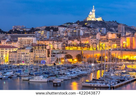 Marseille, France at night. The famous european harbour view on the Notre Dame de la Garde