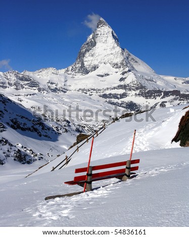 Red chair and Matterhorn, logo of Toblerone chocolate, located in Switzerland
