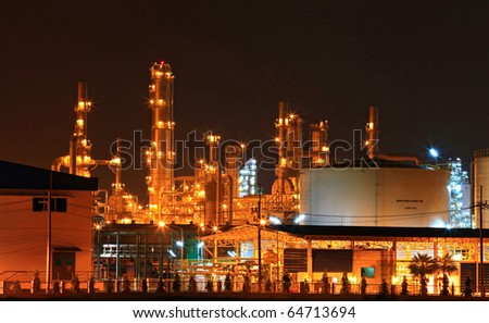 closeup of  petrochemical oil refinery plant and water storage tank