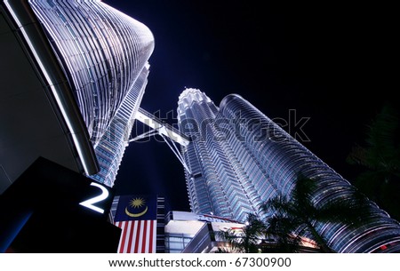 KUALA LUMPUR- JAN 17 : Petronas twin towers shine at dusk on Jan 17, 2009 in Kuala Lumpur. The towers are the world\'s tallest twin buildings in the world.