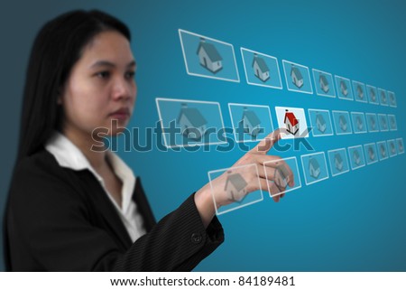 asian business woman select real estate from electronic commerce concept (Selective focus on hand)