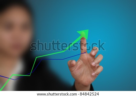 business hand point at up trend graph