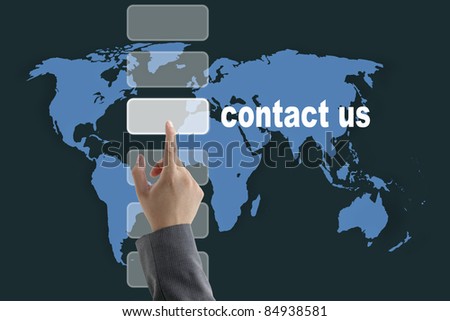 male business hand pushing on contact us button with world map background