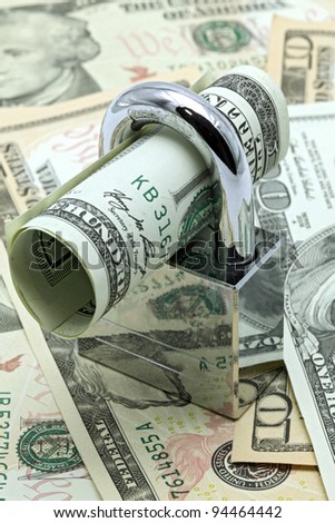 Dollars Banknote bills Locked on Cash background for Money Saving Insurance Concept