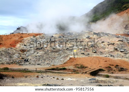 Smoke of Sulfur Mud Volcano Geyser on Plateau Dieng National Park, Java, Indonesia