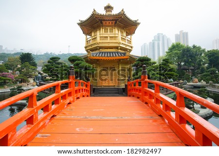 The Golden pavilion and red bridge in Nan Lian Garden near Chi Lin Nunnery, famous landmark in Hong Kong