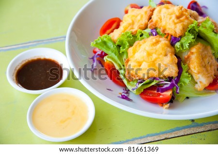 Delicious salad with fish, vegetable and dipping sauce