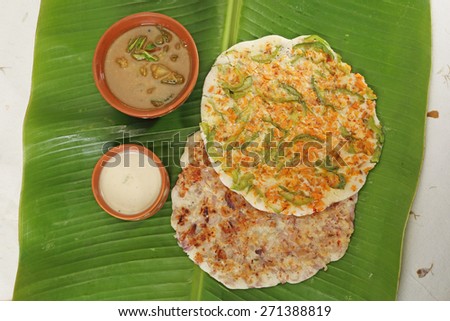 South Indian Dish Uthappams with sambar on Banana Leaf