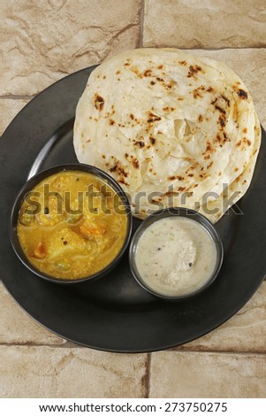 Potato bread with sambar and coconut chutney - south indian curry dish