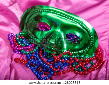 Mardi Gras masks with colorful beads