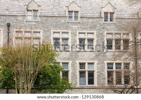 An old stone building with windows and dormers