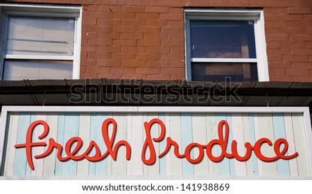 Colorful sign on building for Fresh Produce