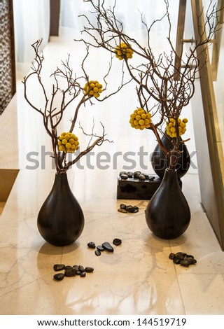 Pebbles And Plants In Pots On A Marble Shelf