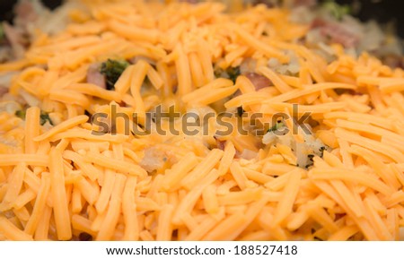 Casserole of hash brown potatoes, ham and broccoli with cheese