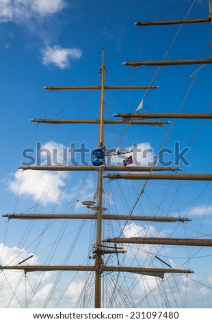Wood masts of an old clipper ship against a nice sky