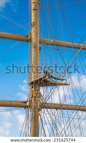 Wood masts of an old clipper ship against a nice sky