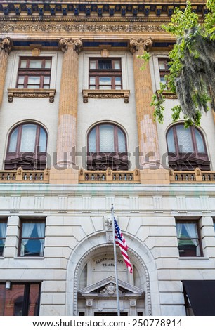 Front of old Scottish Rite temple in Savannah Georgia with American flag out front