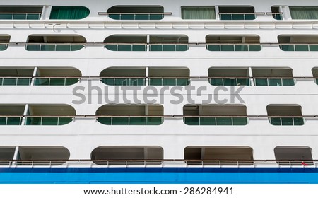 View of balconies and side of a luxury cruise ship in the Caribbean