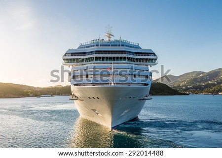 White Luxury cruise ship in bay from front
