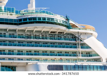 Cruise ship decks under round windows at the top of a luxury cruise ship