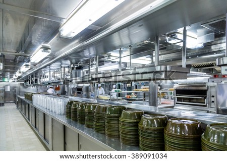 Stacks of Empty Serving Dishes in Commercial Kitchen