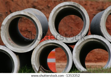 Stack of concrete sewer pipes
