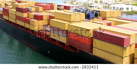 An ocean going freighter loaded with many cargo boxes