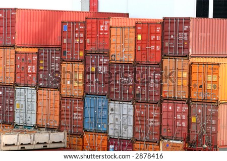 Stack of colorful freight containers on a dock