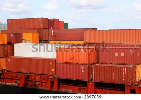 Different colored freight containers on a shipping dock