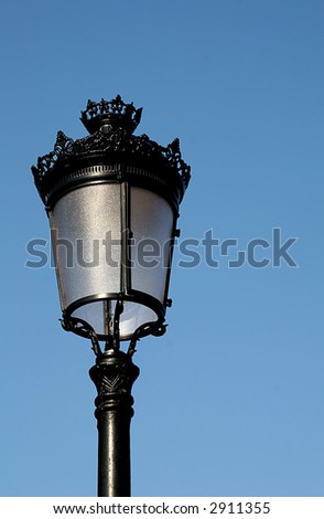 A classic street light against a blue sky