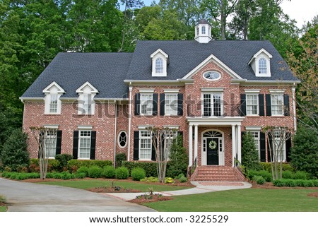 A nice brick two story home with landscaping