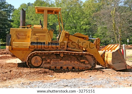 A yellow bulldozer at a job site