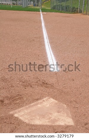 A chalk baseline from home plate to first base on a baseball field